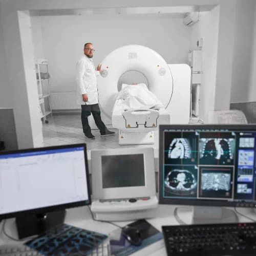 Doctor operating an MRI scanner